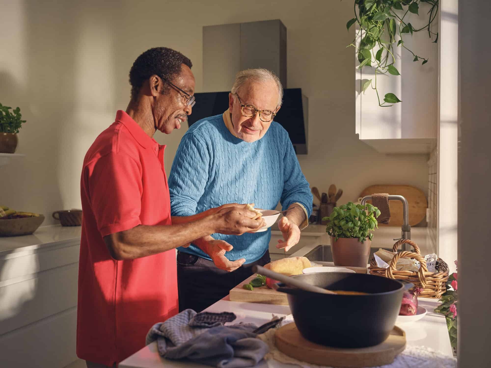 Carer helps client cook his dinner as part of HSE home support service