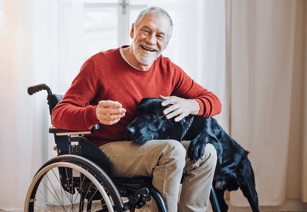 Man with dog lives independent life with Dovida disability support service