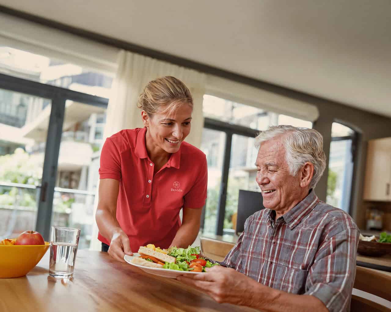 Man enjoys a healthy meal prepared by his Dovida caregiver